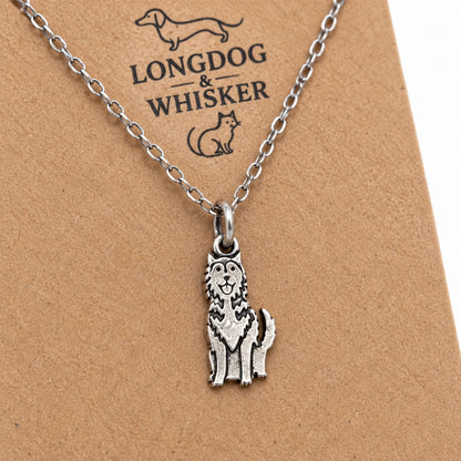 Close-up of the silver-tone husky charm with fluffy chest detailing and raised tail