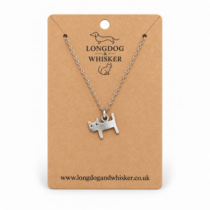 Silver Little Cat Necklace on a silver-tone chain displayed on a Longdog & Whisker kraft card