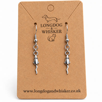 Close-up of the mouse earrings' tiny ears, rounded bodies, wavy tails and linked connectors