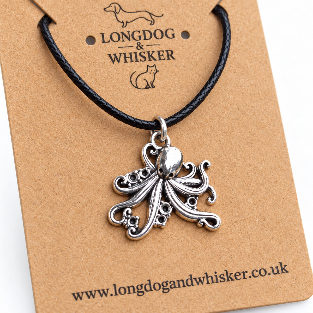 Close-up of the octopus pendant's curled tentacles, sucker detail and black cord connector