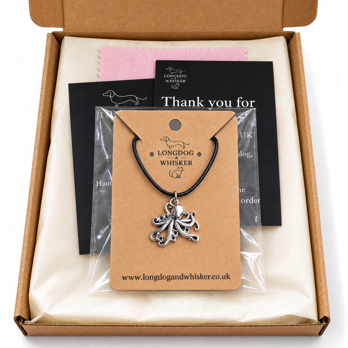 Silver-tone octopus black cord necklace in Longdog & Whisker kraft packaging
