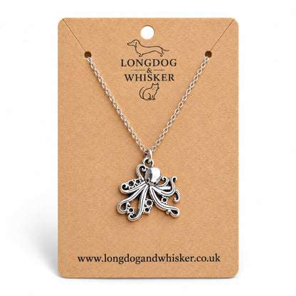 Silver-tone octopus necklace on a silver-tone chain on a Longdog & Whisker kraft card