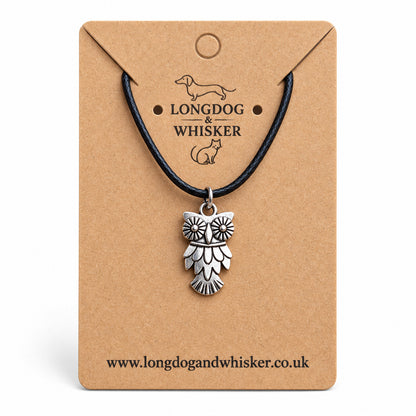 Silver-tone owl necklace on black cord on a Longdog & Whisker kraft card