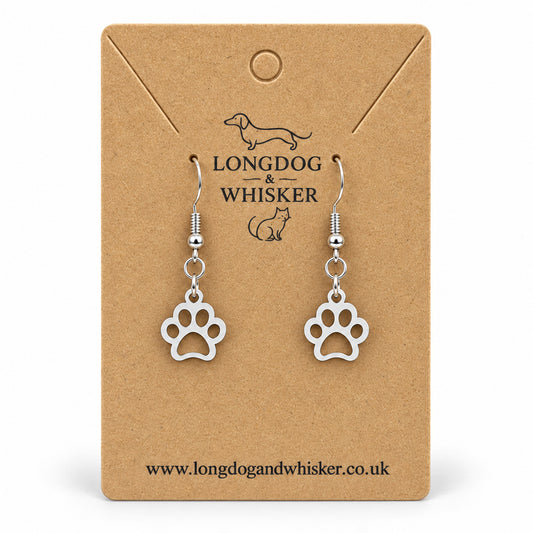 Silver openwork paw print drop earrings on Longdog & Whisker kraft card