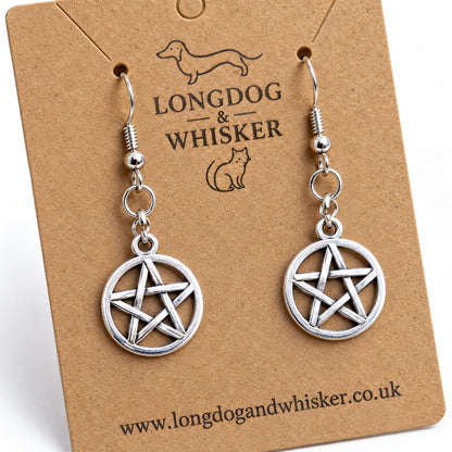 Close-up of the silver openwork pentagram charms and hooks