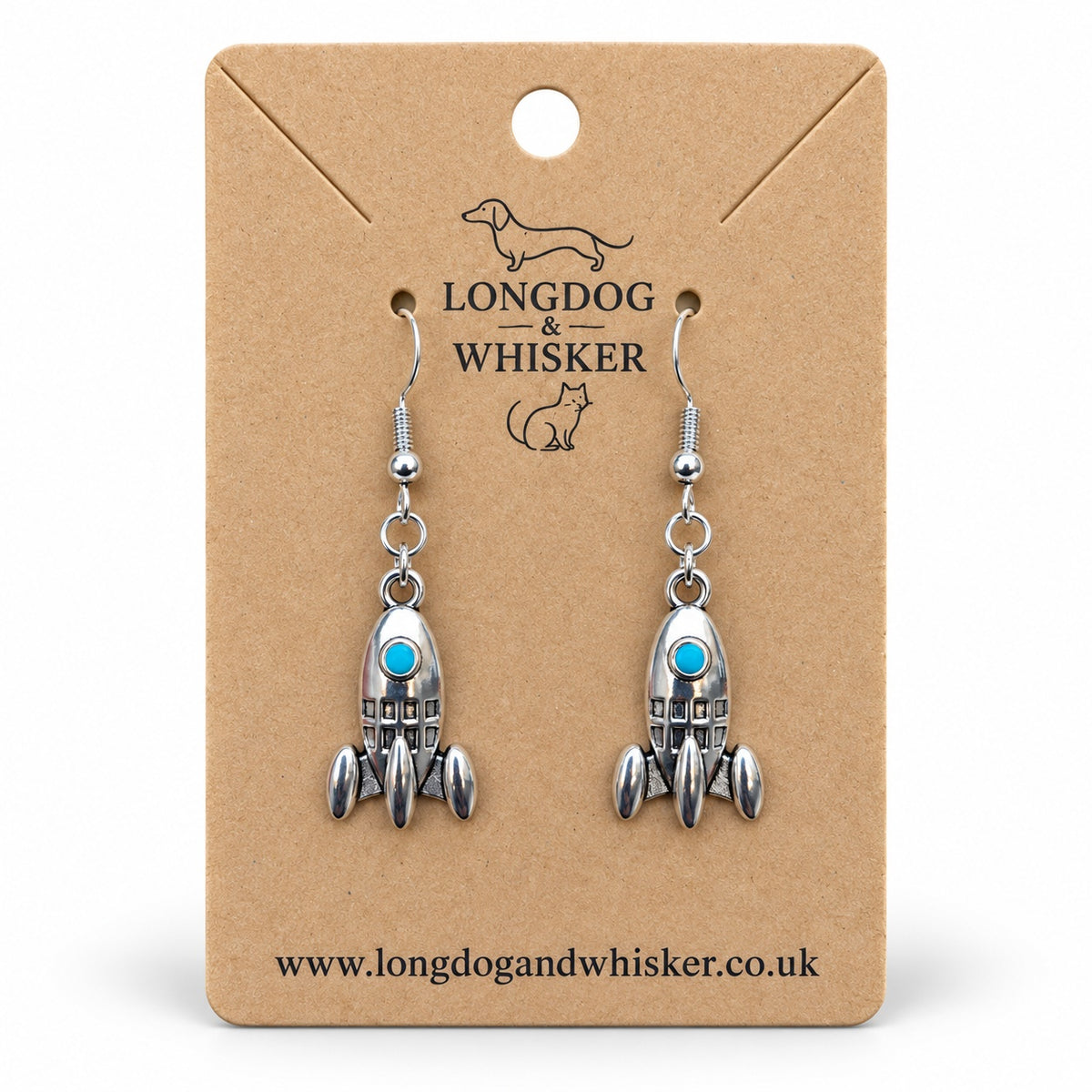 Silver rocket earrings with turquoise portholes on a Longdog & Whisker kraft product card