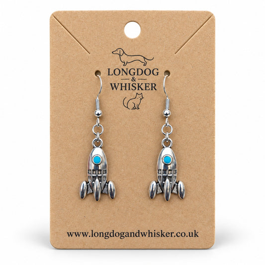 Silver rocket earrings with turquoise portholes on a Longdog & Whisker kraft product card