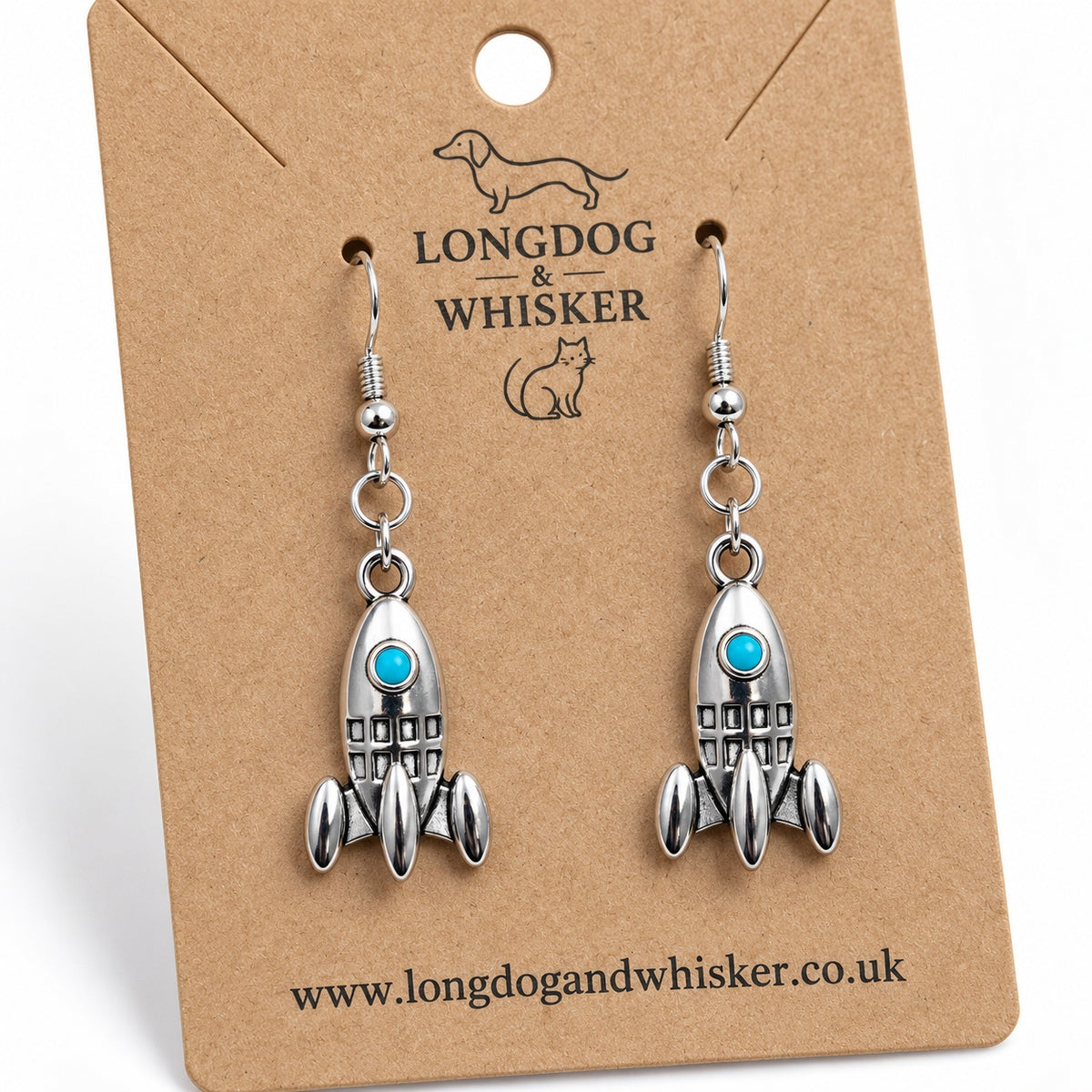 Close-up of the rocket charms, turquoise portholes and silver-tone fishhook fittings