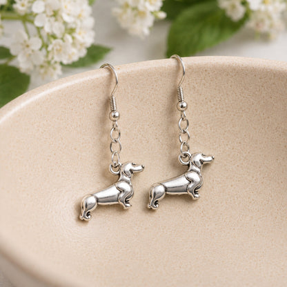 Sausage Dog Earrings - Brushed Silver displayed in a lifestyle product photo