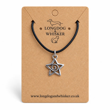 Silver-tone spiral star necklace on black cord on a Longdog & Whisker kraft card