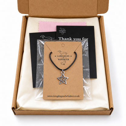 Silver-tone spiral star black cord necklace in Longdog & Whisker kraft packaging