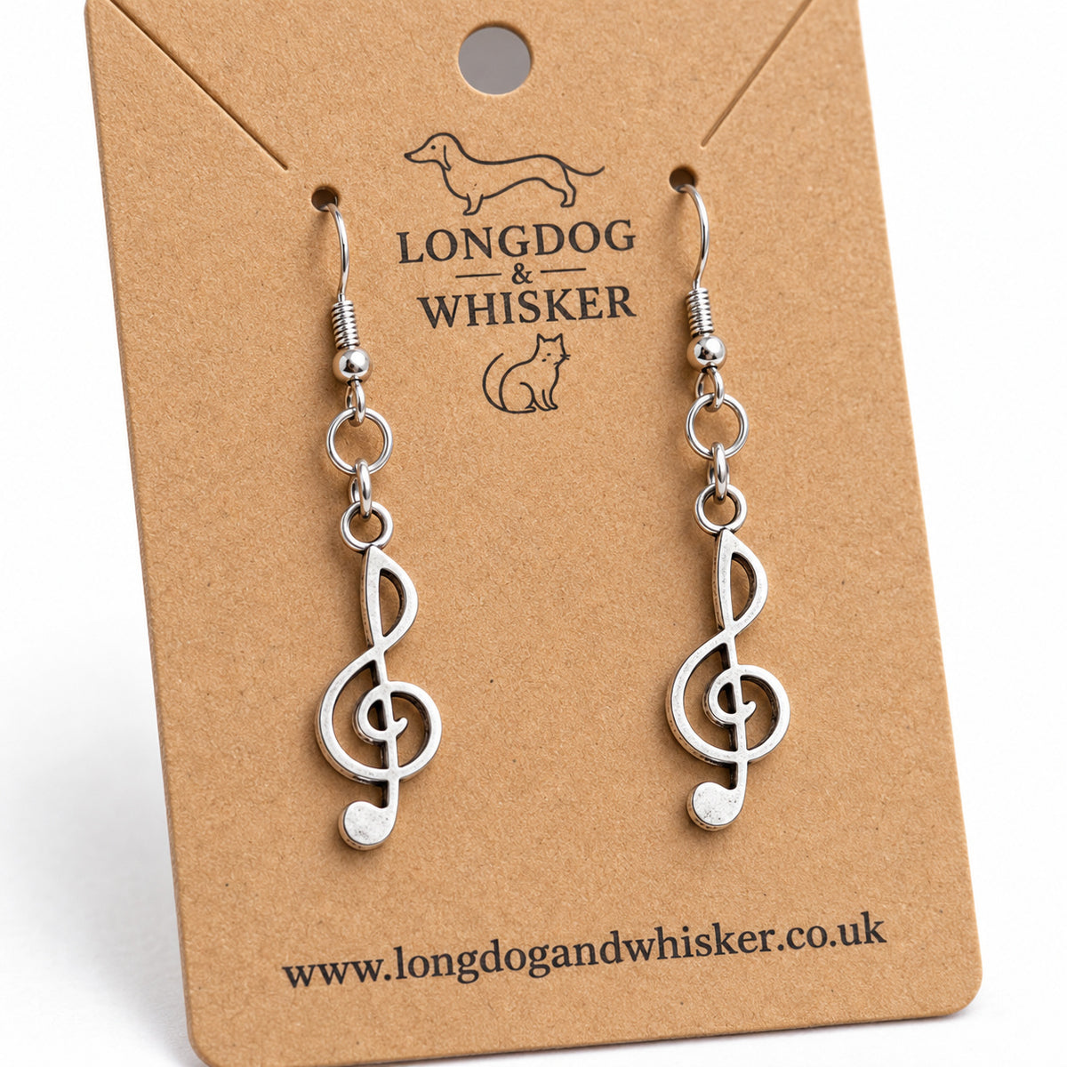 Close-up of the flat treble clef charms and linked earring connectors