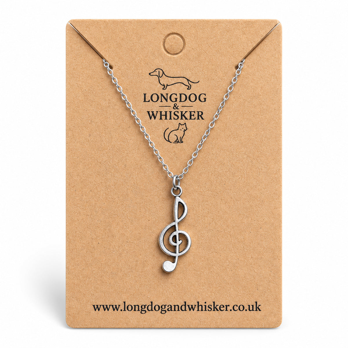 Silver-tone treble clef music note necklace on a silver-tone chain on its kraft product card