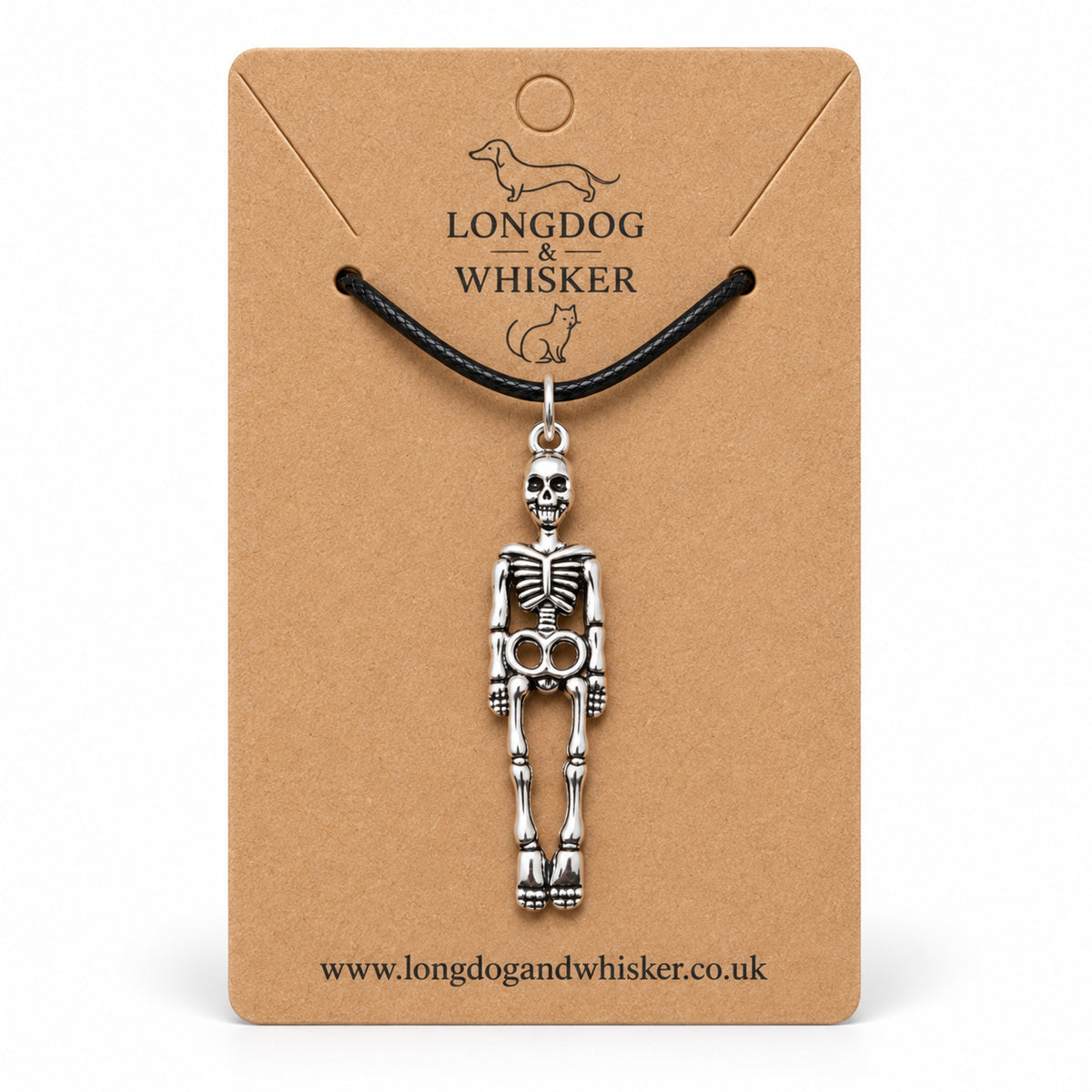 Silver-tone skeleton pendant on a black cord, displayed on a Longdog & Whisker kraft card