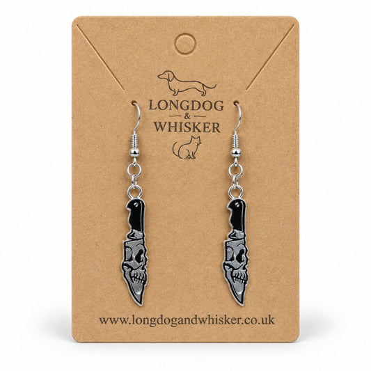 Skull Blade Knife Drop Earrings displayed on a Longdog & Whisker card