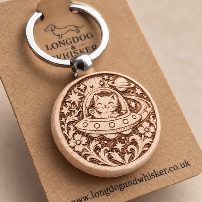 Close-up of the Space Cat UFO wooden keyring engraving