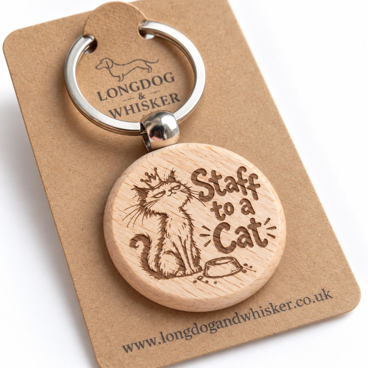 Close-up of Staff to a Cat wooden keyring showing crowned cat, bowl engraving and rounded wood edge