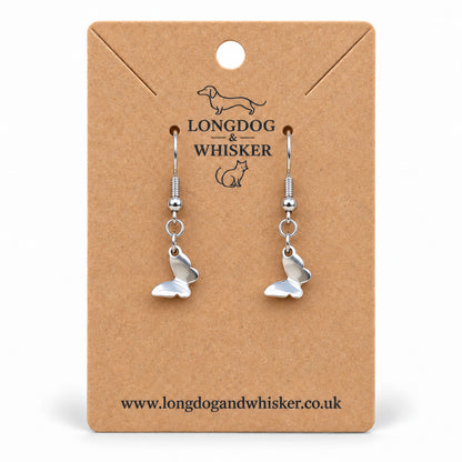 Stainless steel butterfly drop earrings on a Longdog & Whisker kraft card