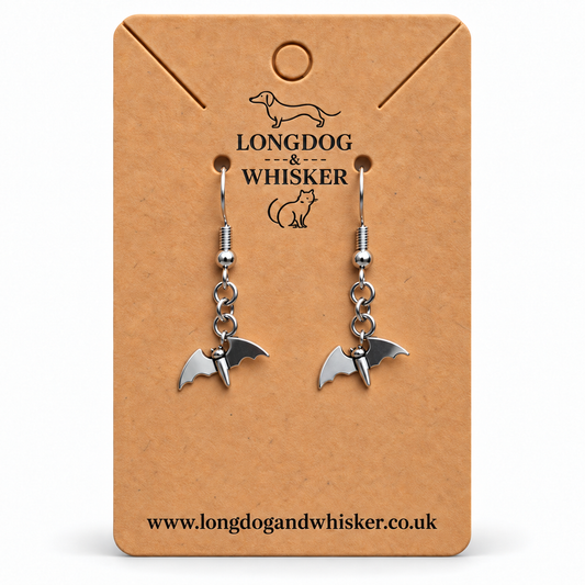 Stainless steel flying bat drop earrings on a Longdog and Whisker card
