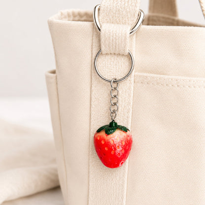 Strawberry Keyring shown as a bag charm