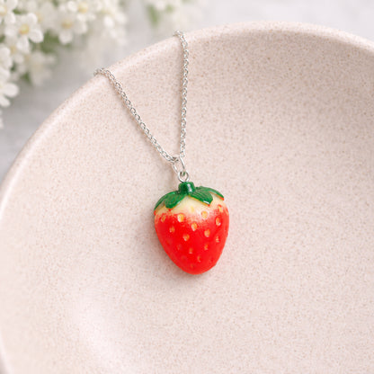 Strawberry Necklace - Silver Chain displayed in a lifestyle product photo
