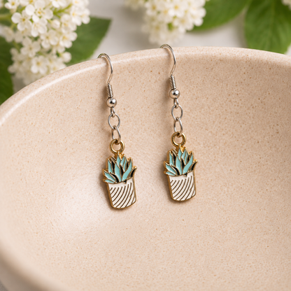 Stripy Succulent Earrings hanging from a ceramic bowl