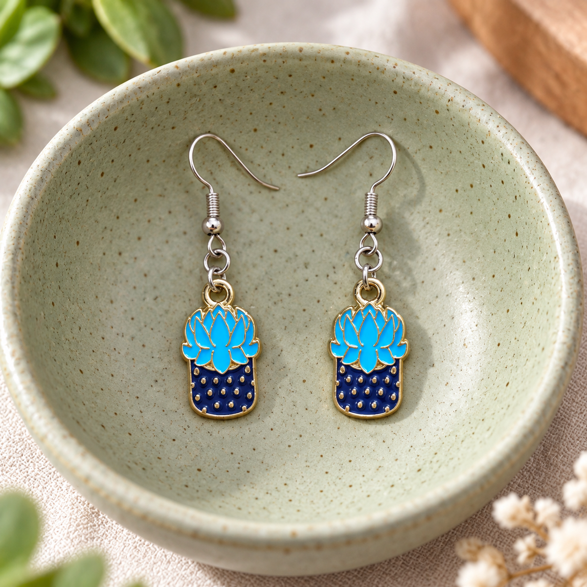 Succulent Blue Earrings hanging from bowl with silver hooks