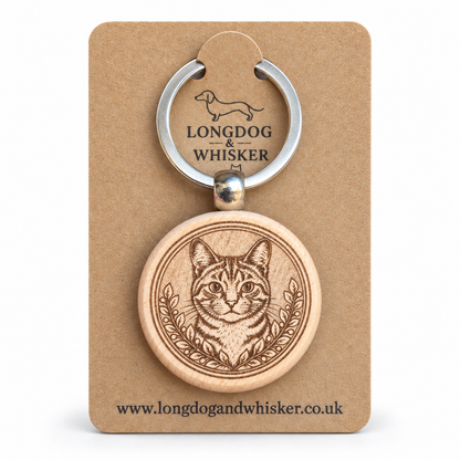 Tabby cat wooden keyring with striped portrait and leafy frame on Longdog & Whisker card