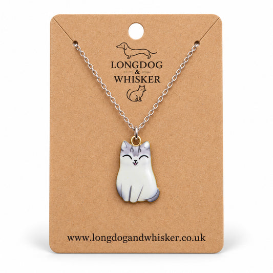 Tonki chonky cat necklace on a silver chain, displayed on a Longdog & Whisker kraft card