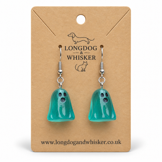 Translucent aqua ghost earrings on a Longdog & Whisker kraft display card.