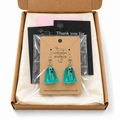 Aqua ghost earrings on their display card in Longdog & Whisker postal packaging.