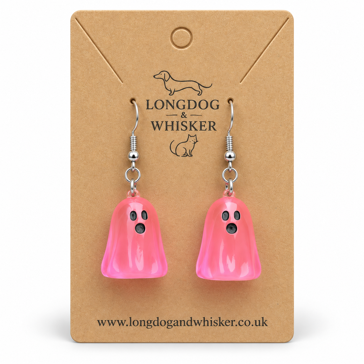 Translucent bright pink ghost earrings on a Longdog & Whisker kraft display card
