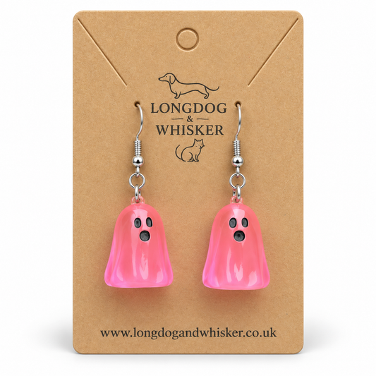 Translucent bright pink ghost earrings on a Longdog & Whisker kraft display card
