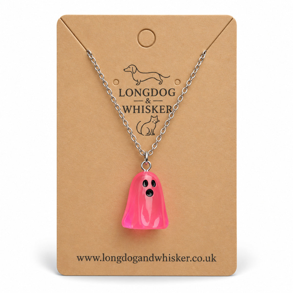 Translucent bright pink ghost necklace with silver chain on a Longdog & Whisker kraft card.
