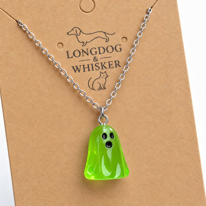 Close-up of the translucent green ghost pendant and silver connecting rings.
