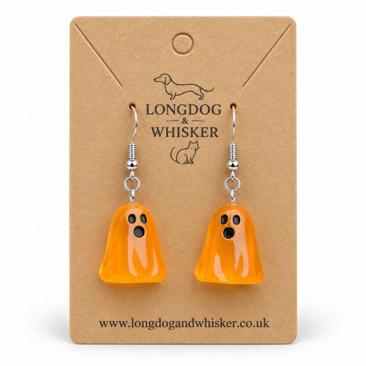 Translucent orange ghost earrings with silver hooks on a Longdog & Whisker kraft card