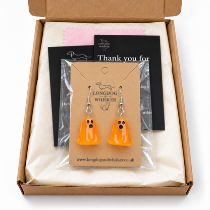 Translucent orange ghost earrings in Longdog & Whisker gift packaging