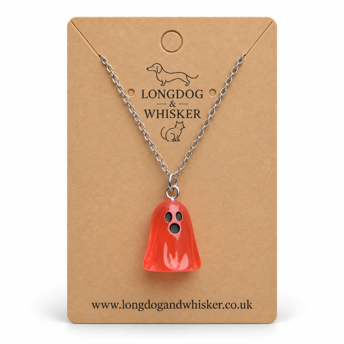 Translucent pale red ghost necklace with silver chain on a Longdog & Whisker kraft card.