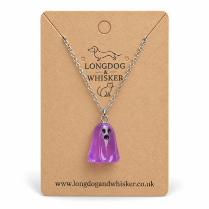 Translucent purple ghost necklace with silver chain on a Longdog & Whisker kraft card.