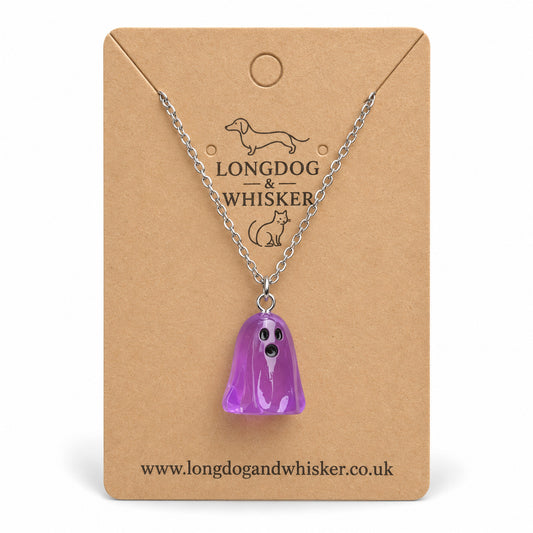 Translucent purple ghost necklace with silver chain on a Longdog & Whisker kraft card.