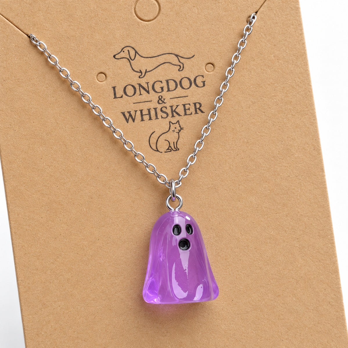 Close-up of the translucent purple ghost pendant and silver connecting rings.