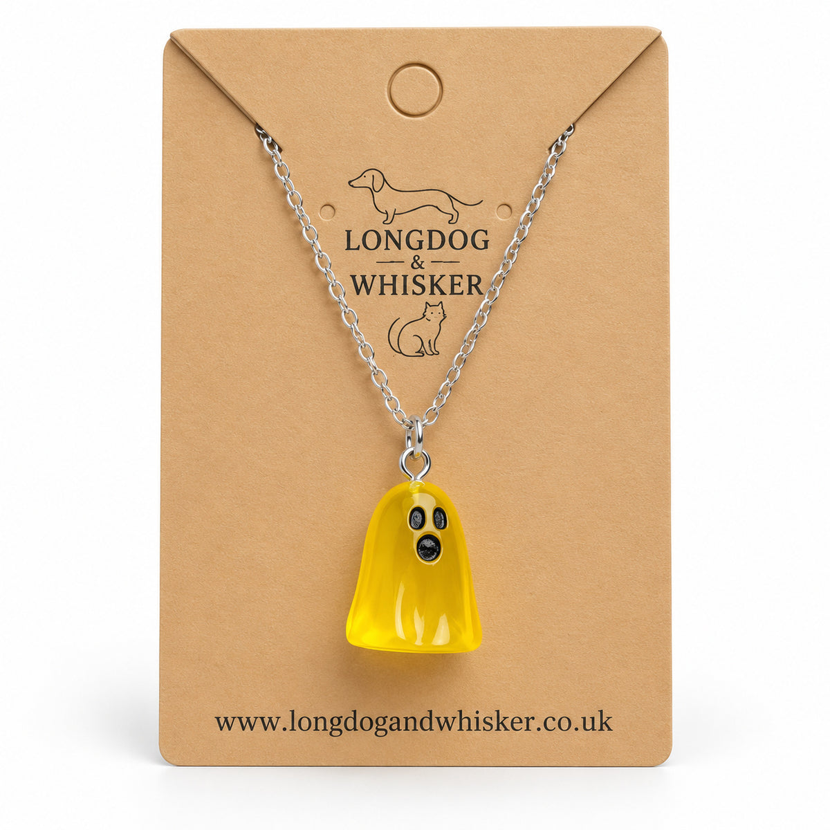 Translucent yellow ghost necklace with silver chain on a Longdog & Whisker kraft card.
