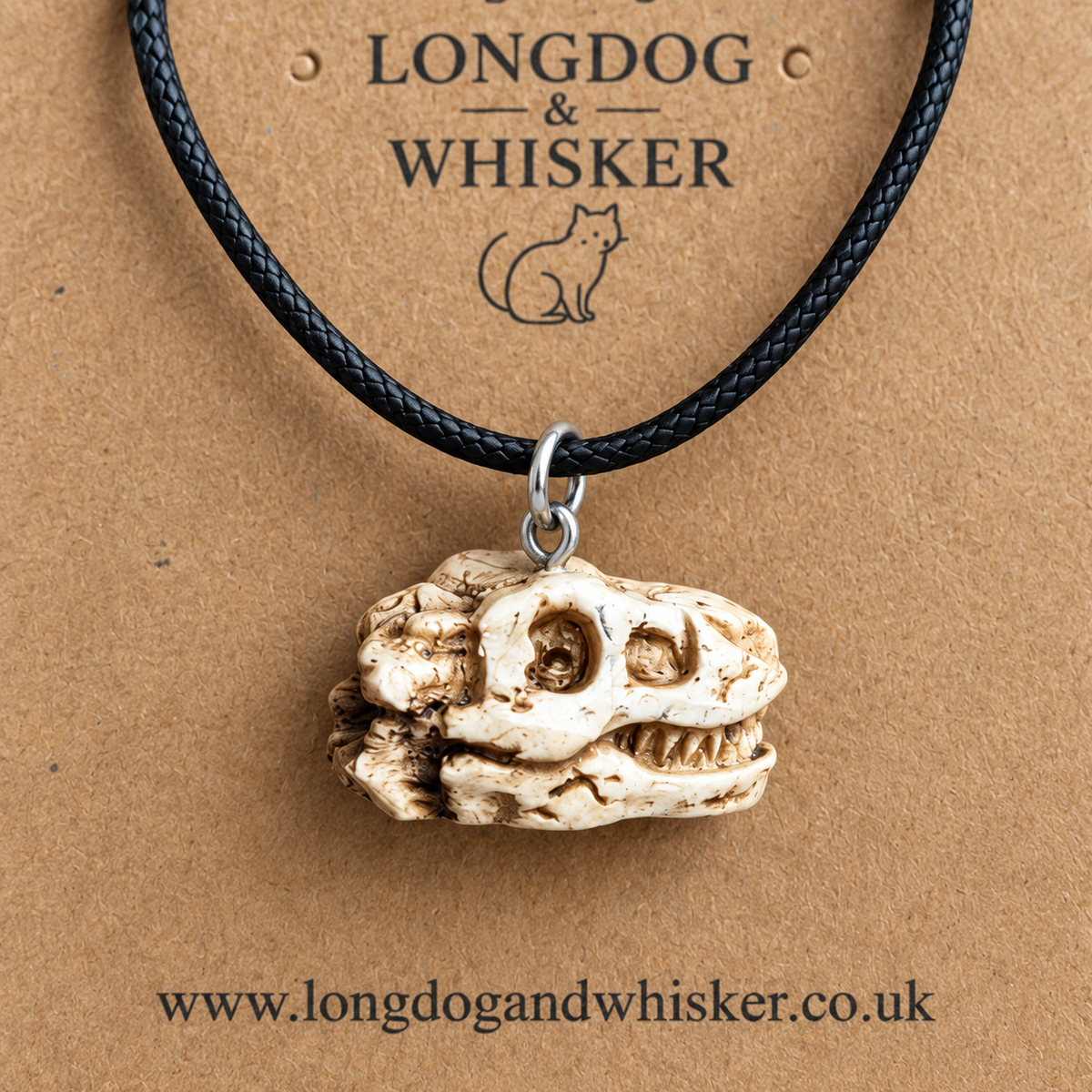 Close-up of the distressed bone-white T-Rex skull necklace pendant