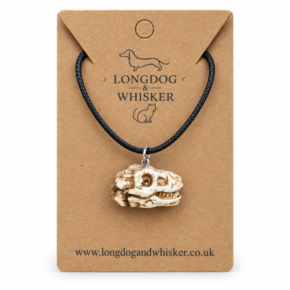 T-Rex dinosaur skull necklace on Longdog & Whisker display card