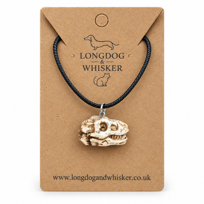 T-Rex dinosaur skull necklace on Longdog & Whisker display card