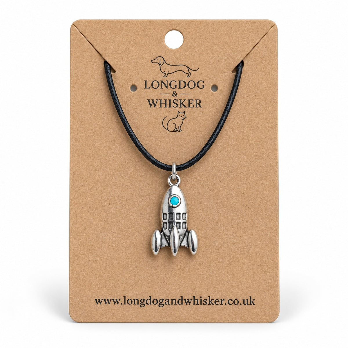 Silver-tone rocket necklace with turquoise porthole on black cord, displayed on a Longdog & Whisker kraft card