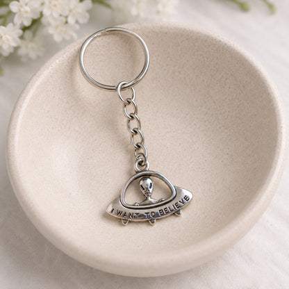 UFO Believe Keyring and Bag Charm styled in a ceramic bowl
