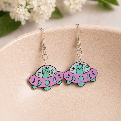 UFO Space Kitty Earrings displayed in a lifestyle product photo