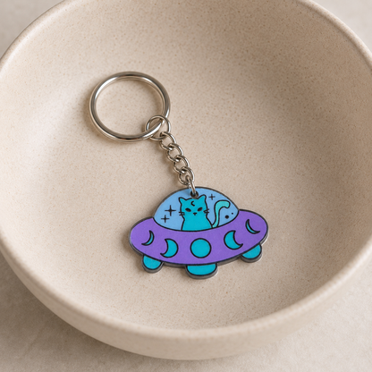 UFO Space Kitty Keyring / Bag Charm displayed in a lifestyle bowl photo