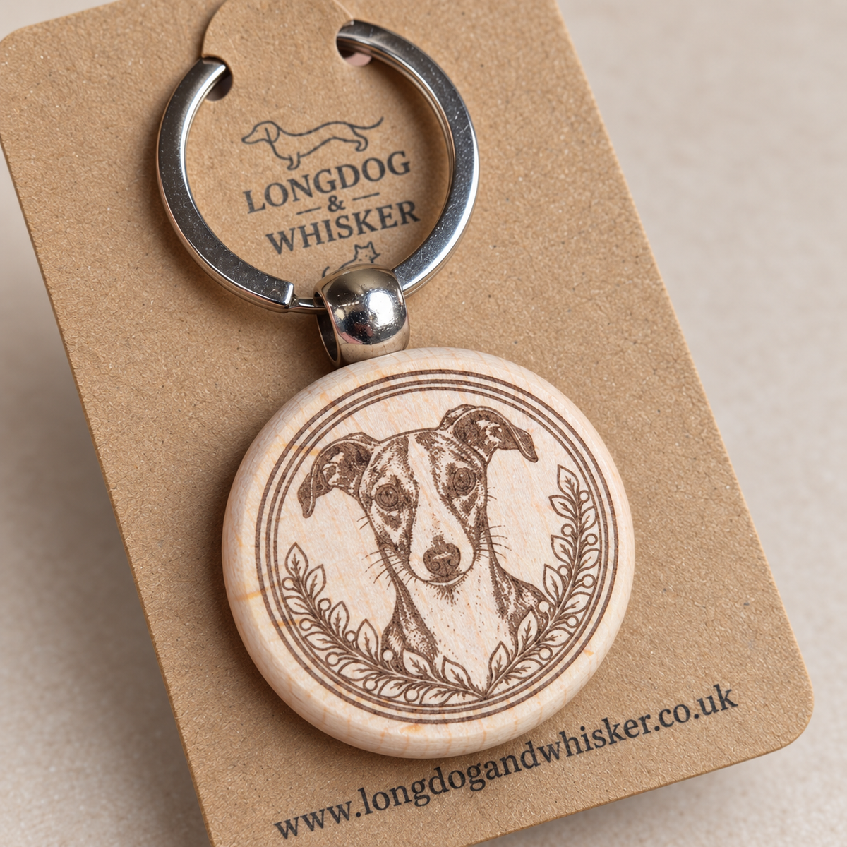 Close-up of Whippet portrait, leafy border, natural wood edge and silver connector